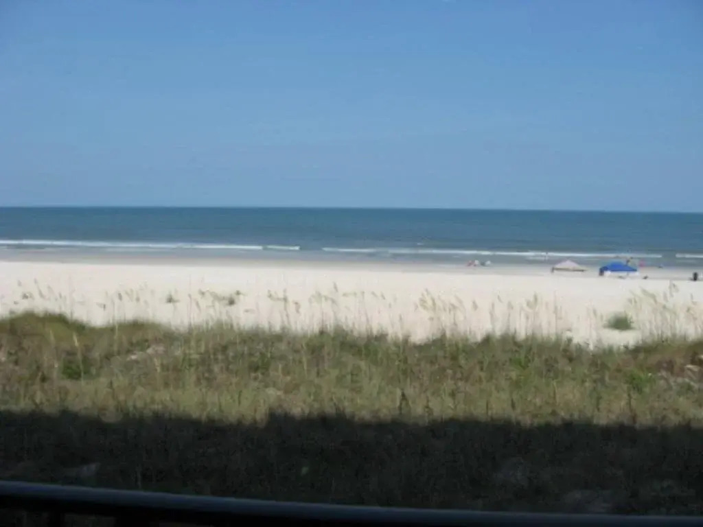 Coastline Condo with private Balcony to Enjoy Views of the Atlantic Ocean by RedAwning