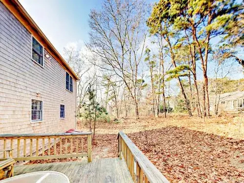 Woodsy Cape Cod Home by RedAwning