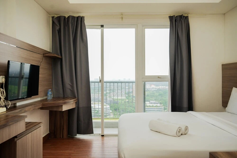 Comfort And High Floor Studio Room At Casa De Parco Apartment