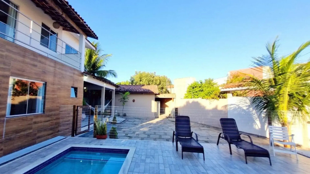 Casa de 4 suítes com piscina e área gourmet em Porto Seguro - Casa dos Ipês