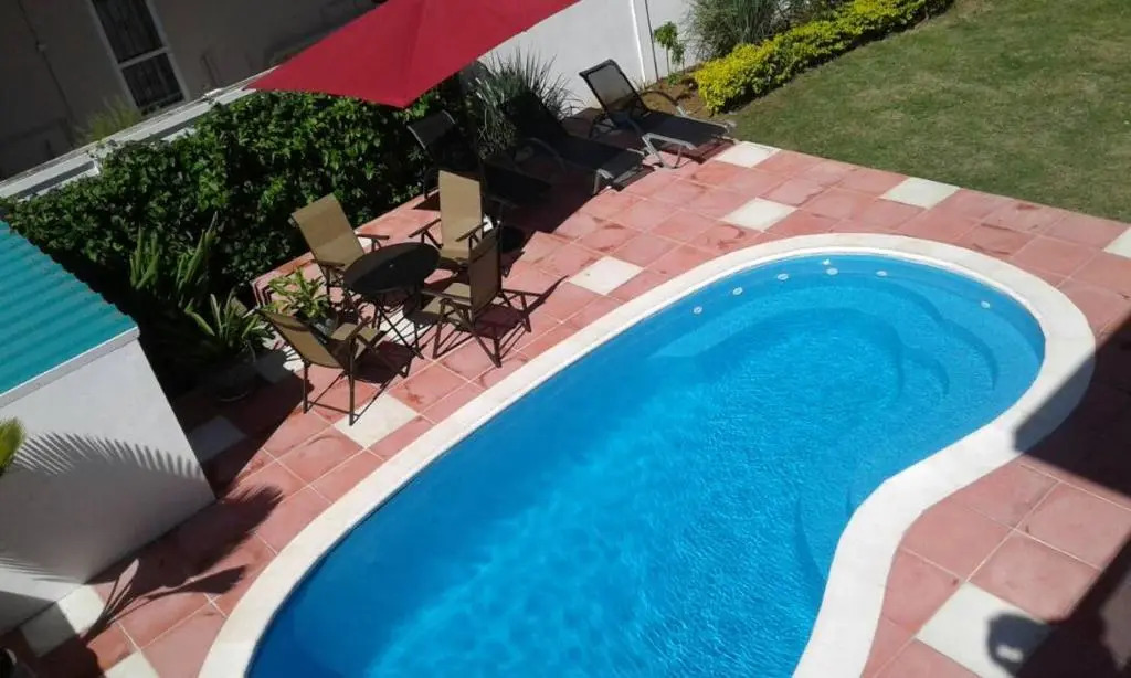 Cardamon Villa is a 2 bedroom with 1 bathroom and seperate toilet detached house with AC and swimming pool , 5 minutes walk from Flic en Flac public beach