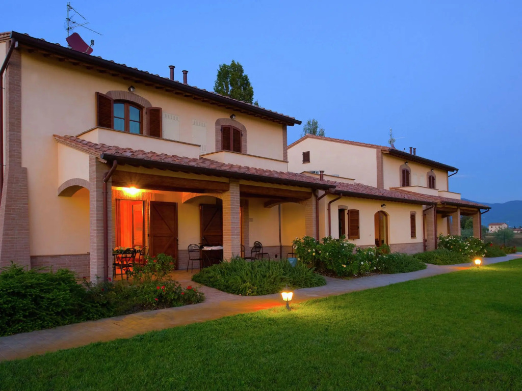 An agritourism complex with views of Assisi.