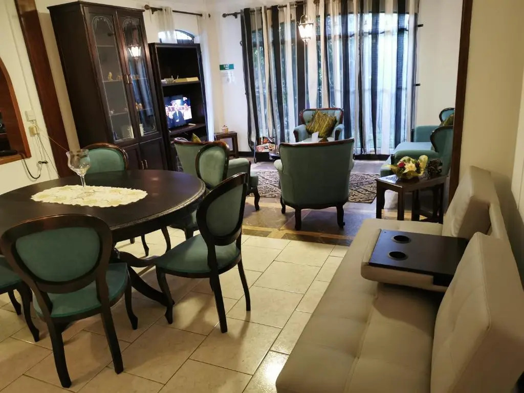 R&G Justlikehome Apartment 1 with blue sofa set and Apartment 2 with Garden View with brown sofa set