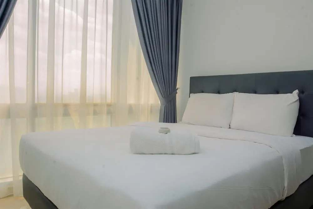 Comfy and Spacious 2BR The Masterpiece Epicentrum Apartment By Travelio