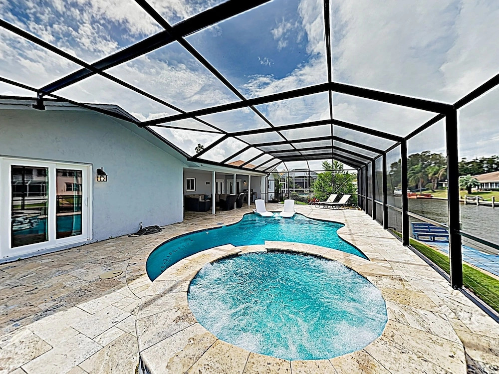 Waterfront W/ Stunning Views, Pool, Boat Dock 4 Bedroom Home