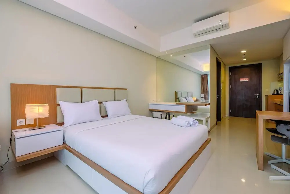 Cozy Living and Spacious Studio at 28th Floor Kemang Village Apartment By Travelio