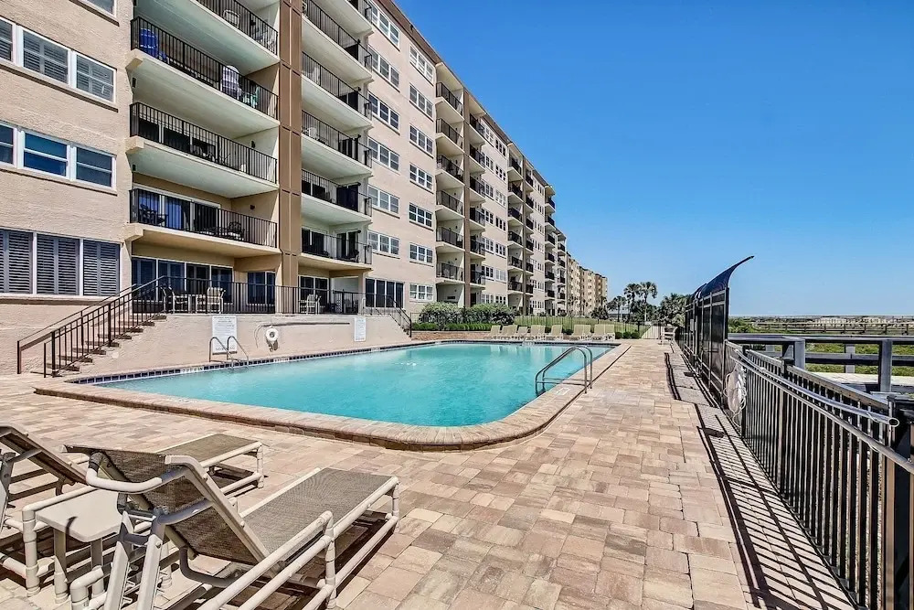 Oceanfront Beach Condo with Private Balcony, Short Walk to Pool and Beach by RedAwning