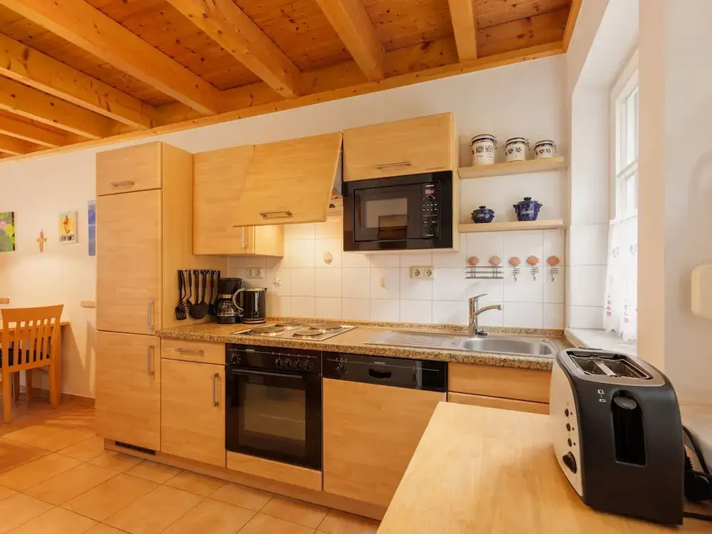 Cozy Holiday Home with Wood Burning Stove near Water
