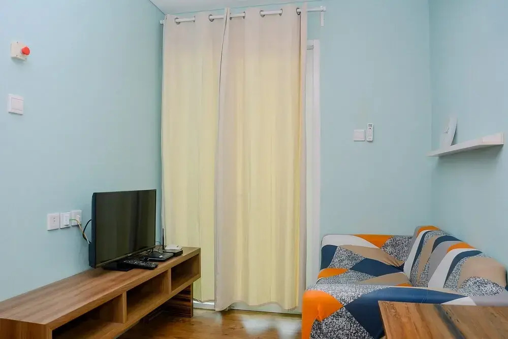 Modern and Comfy 1BR Apartment at Woodland Park Residence By Travelio