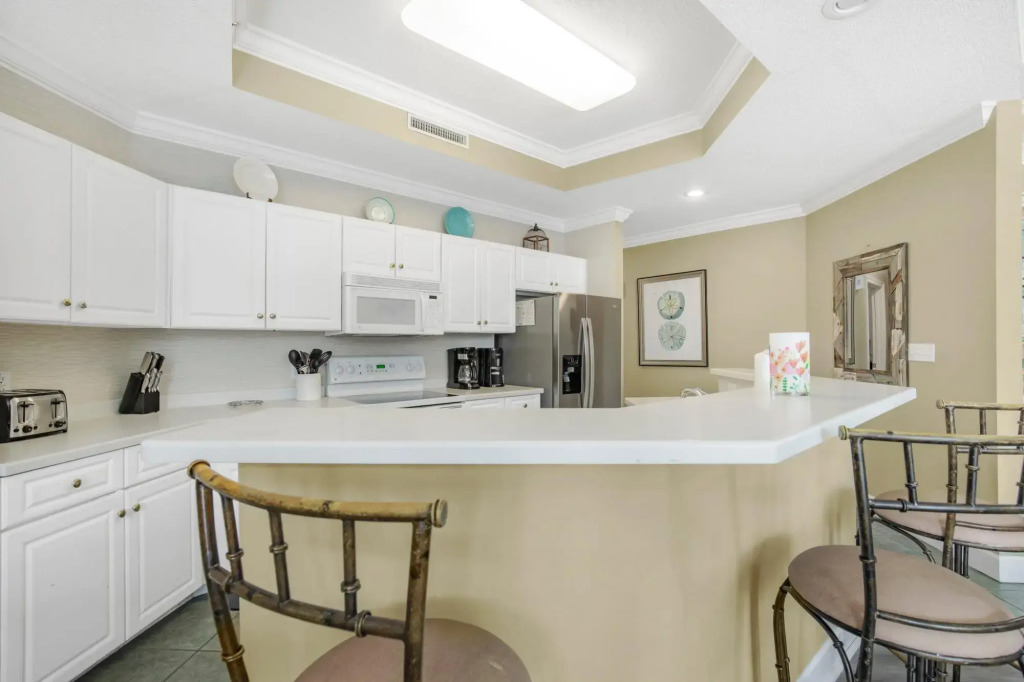 Condo on bay with boat launch and multiple pools