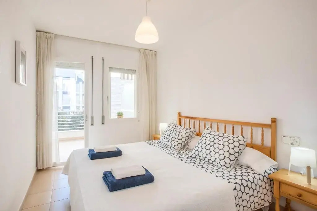 Lets Holidays White Apartment with Terrace, AC & Parking, Near Beach