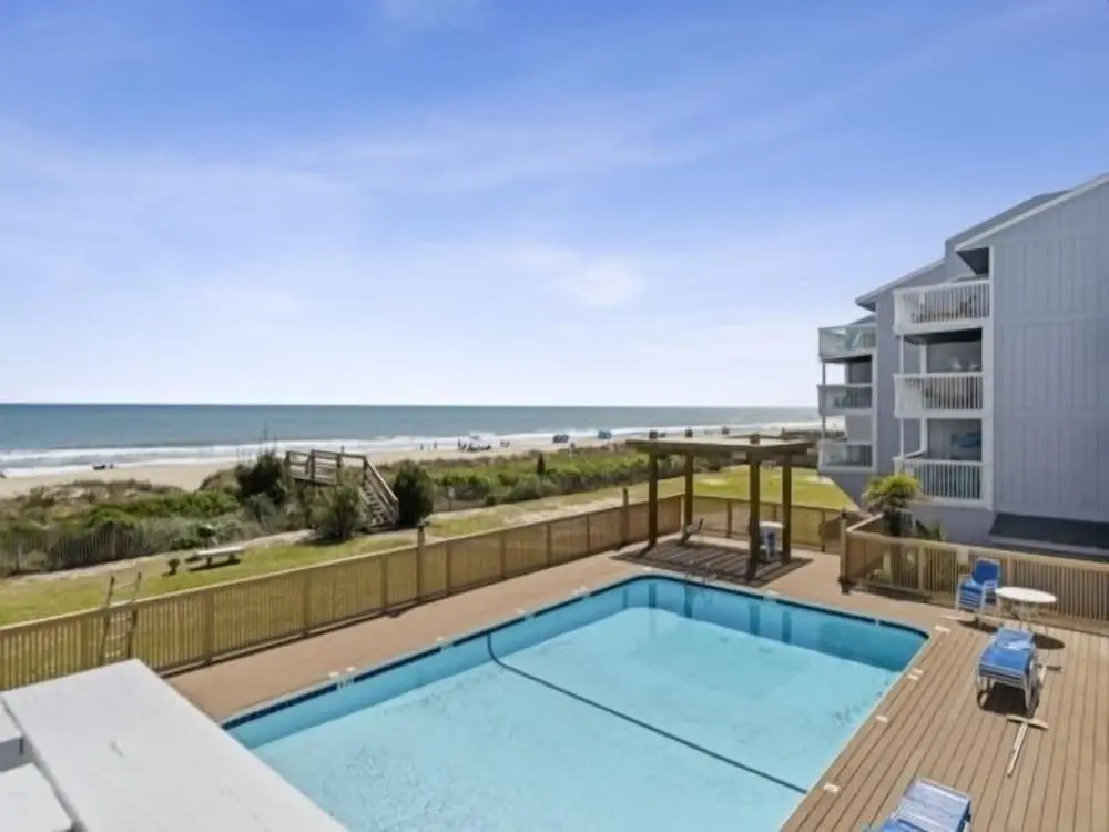 Conched Out - Feel The Ocean Breezes As You Relax On The Deck Overlooking The Lovely Carolina Beach Coastline 2 Bedroom Condo by RedAwning