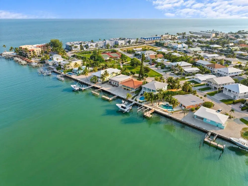 Sunset Harbor Waterfront Villa with Dock Cabana Club