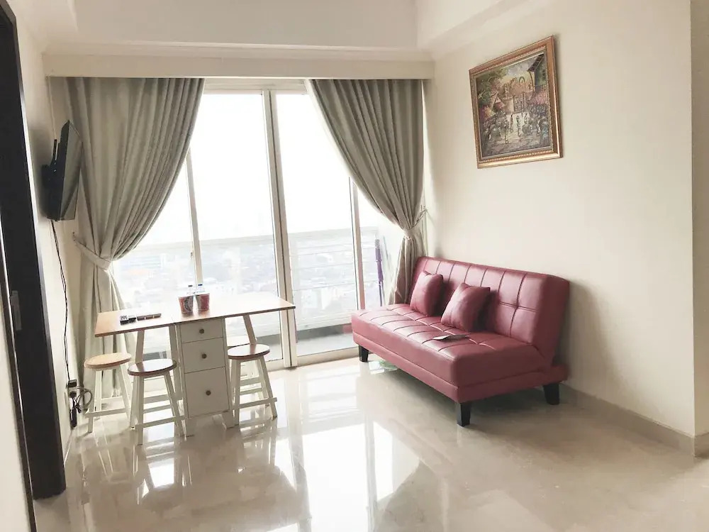 Luminous 2 Bedrooms at Menteng Park Apartment by Travelio