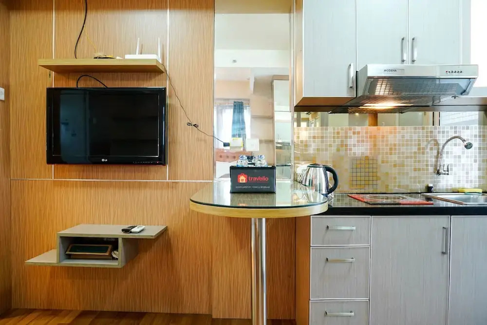 Furnished Studio with Comfortable Design Green Pramuka Apartment