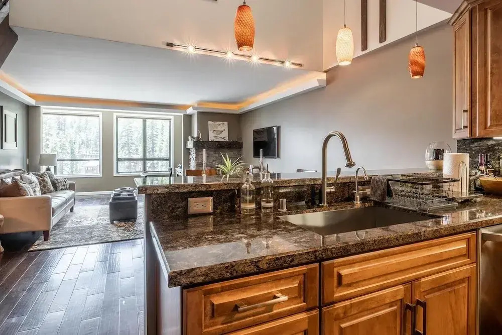 DELUXE SLOPESIDE Condo with 4th FLOOR VIEWS, Elevator and Underground Parking at Canyon Lodge (1849 Condos 409) by RedAwning