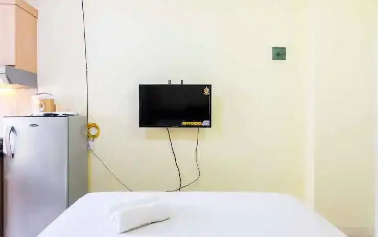 Compact and Cozy Studio Apartment Green Pramuka City By Travelio