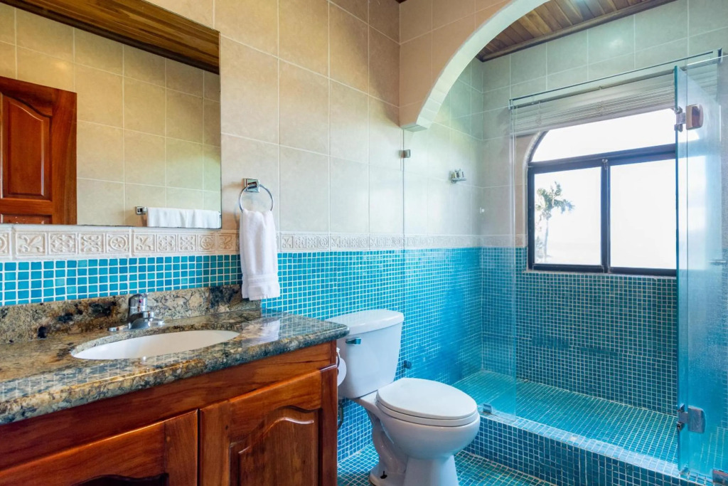 Beachfront Condo with Warm, Rustic Interiors & Direct Access to Playa Flamingo