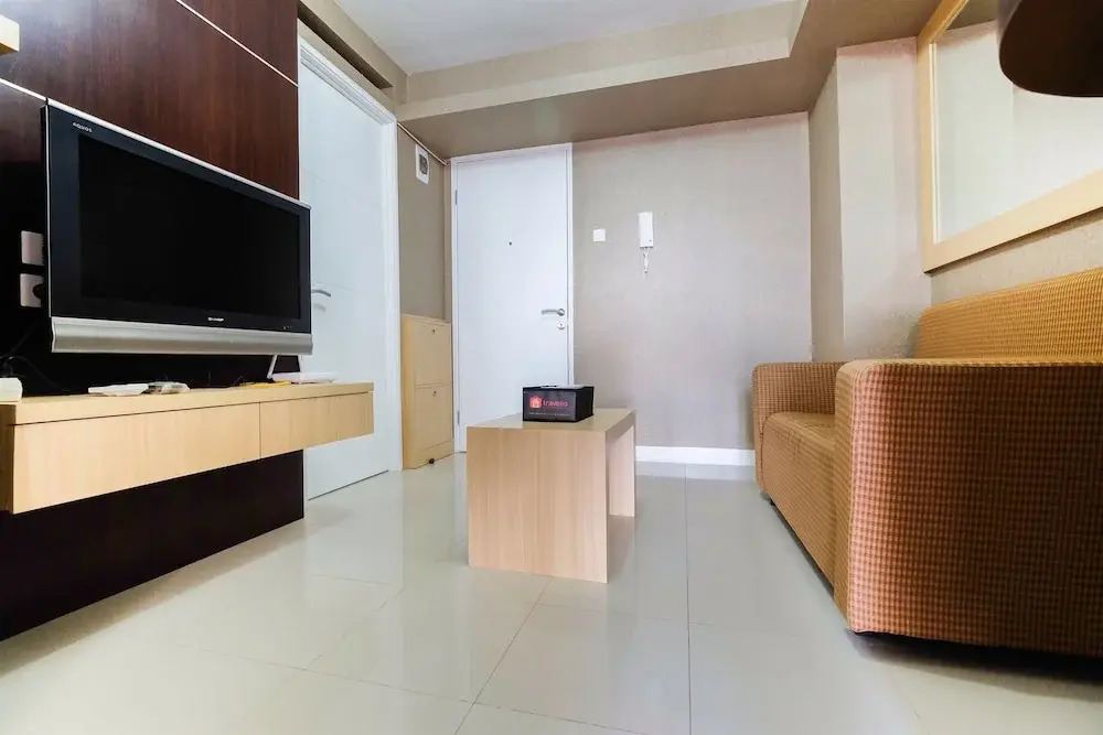 Homely 2 BR Bassura City Apartment By Travelio