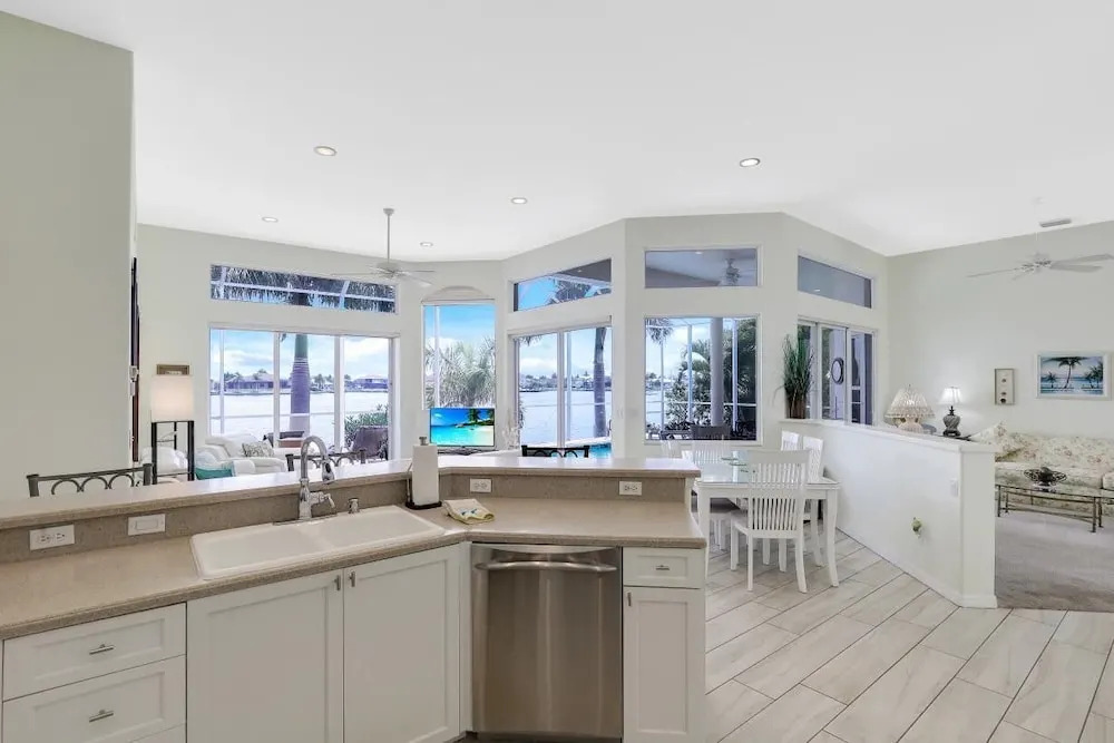 Waterfront home with views, pool and walk to beach