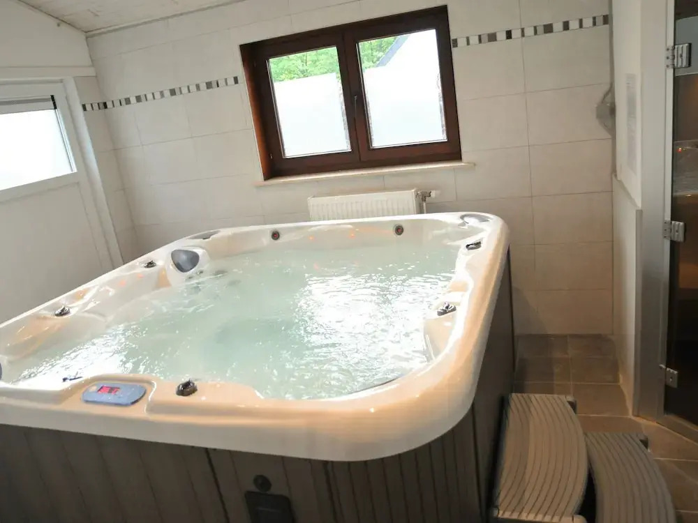 Holiday Home with Hot Tub & Steam Room in Forest
