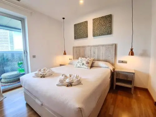 Fira Suites - Habitaciones privadas en Apartamento compartido