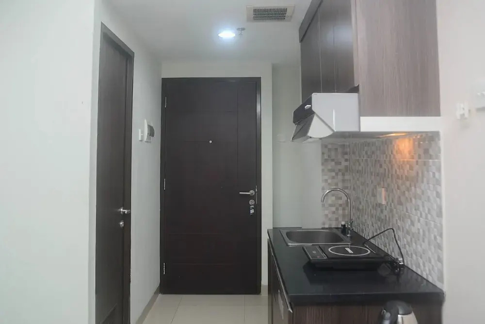 Minimalist and Comfy Studio at Grand Dhika City Apartment By Travelio