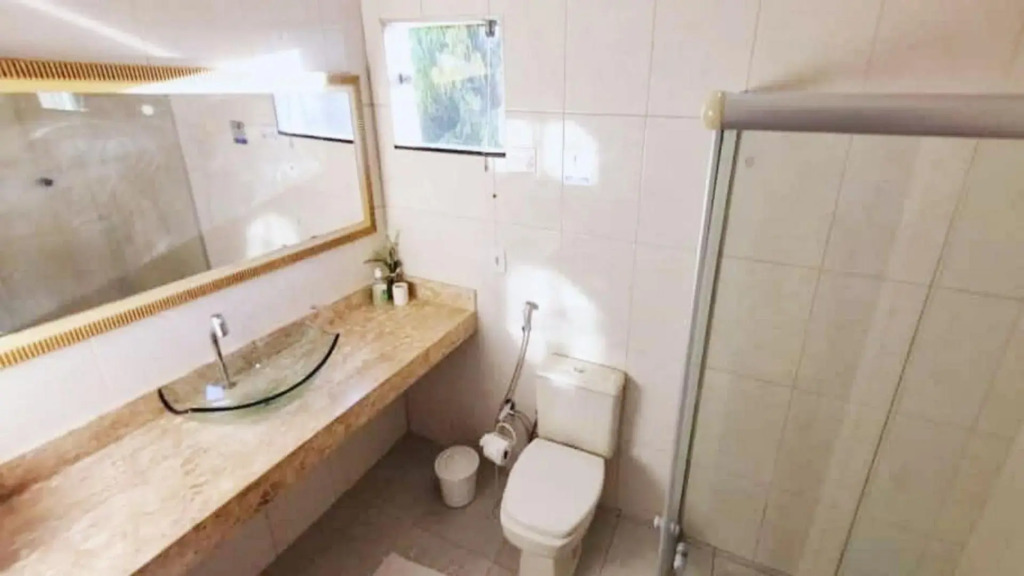 Casa de 4 suítes com piscina e área gourmet em Porto Seguro - Casa dos Ipês