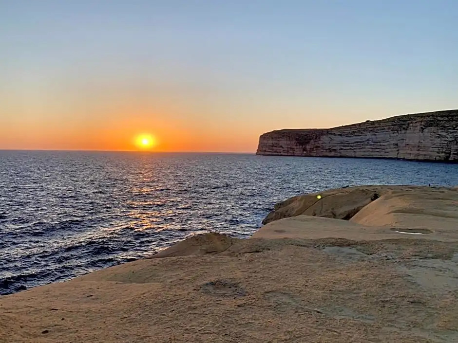 Private bedroom with balcony in a shared apartment at the Bay of Xlendi