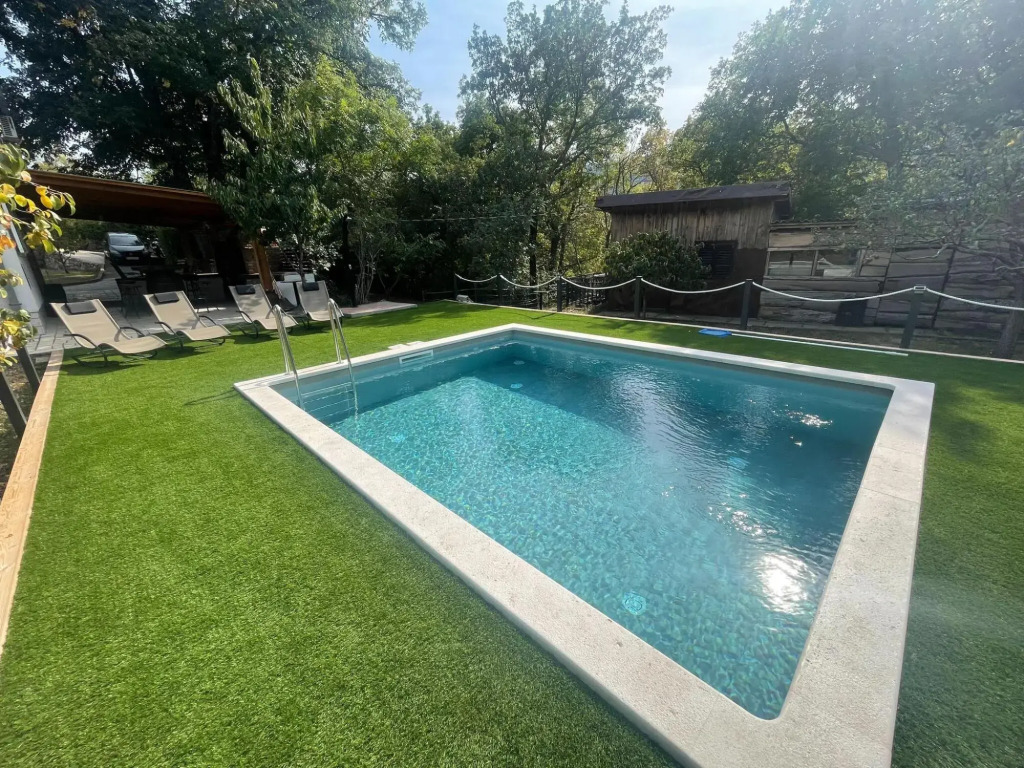 Vacation home with private swimming pool surrounded by nature