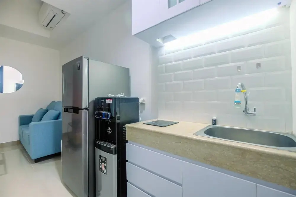 Comfort 1BR Apartment at Evenciio Margonda By Travelio