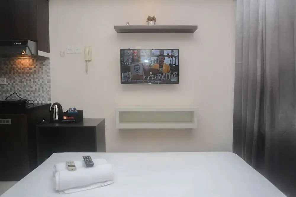 Minimalist and Comfy Studio at Grand Dhika City Apartment By Travelio