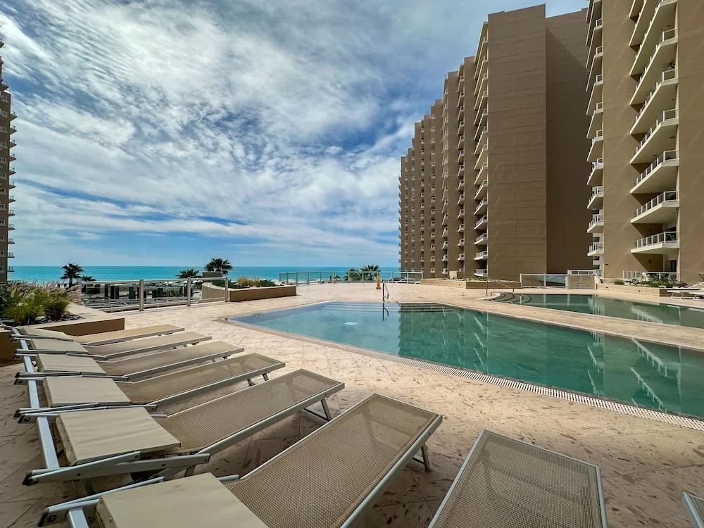 Brand-new Modern 2BR Gem on Iconic Sandy Beach