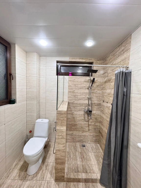 Апартаменты Two-bedroom family apartment for four guests with one large bed and two sofa beds