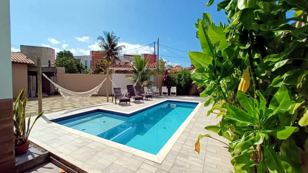 Casa de 4 suítes com piscina e área gourmet em Porto Seguro - Casa dos Ipês
