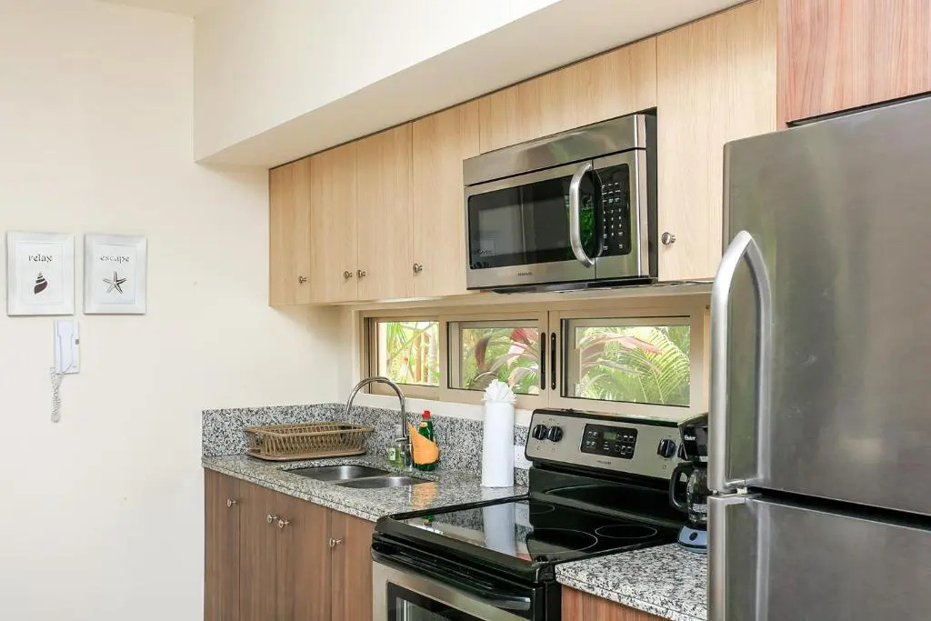 Condo Complex with an Alluring Pool & Tropical Vibes by Stella Rentals