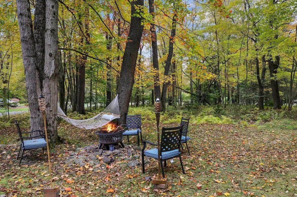 Game Room & Fire Pit: Tree-lined Pocono Lake Cabin