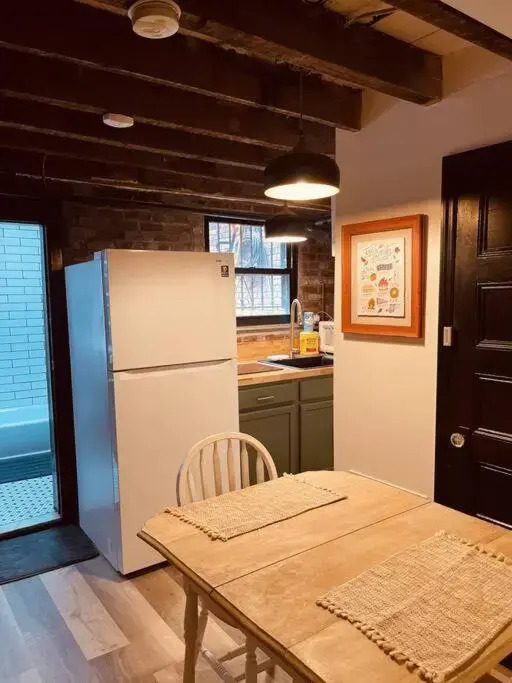 1850s historic Row House 7min train to NYC with private backyard