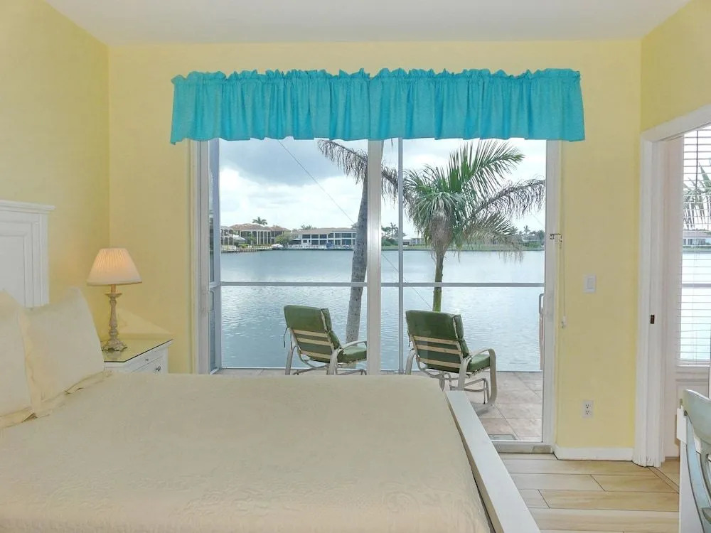 Waterfront home with views, pool and walk to beach