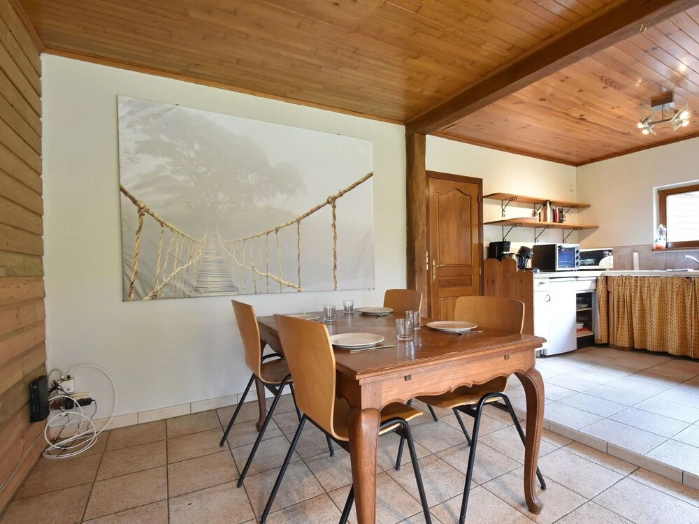 Nestled In A Green Scenery, This Chalet Along The River Is Perfect To Chill Out!