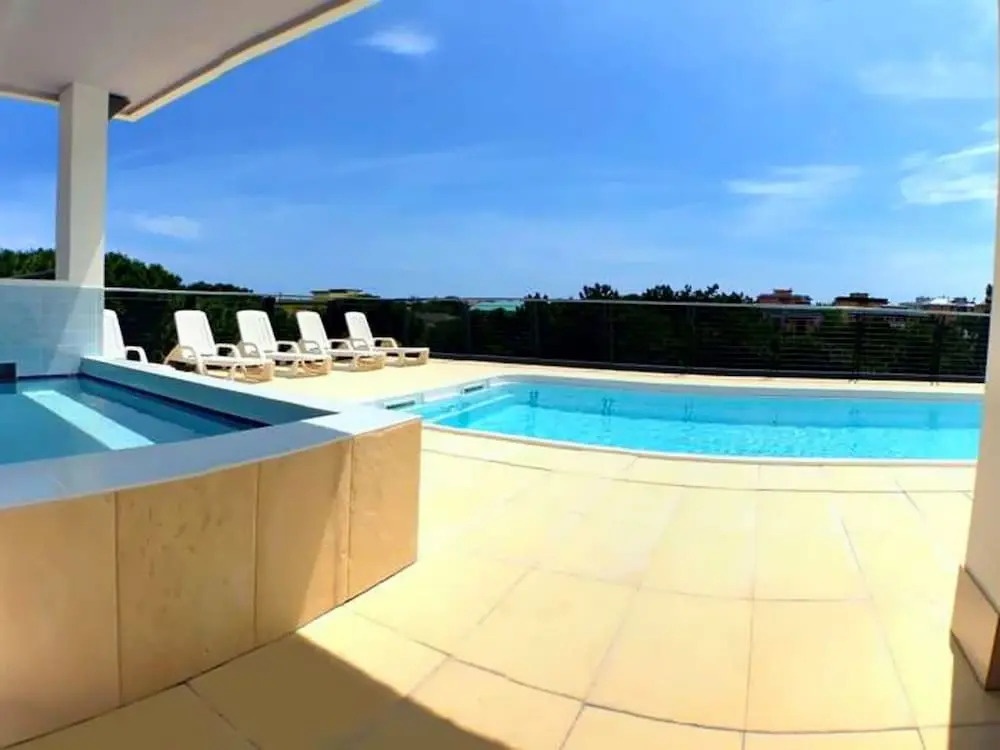 Sunny Terrace and Modern Comforts by the Pool