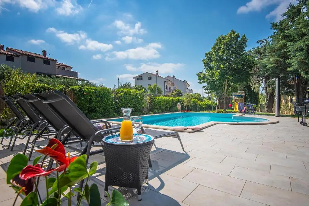 Villa Andrija Family Dream with heated pool at the sea with beautiful garden, outside cinema and kids playground