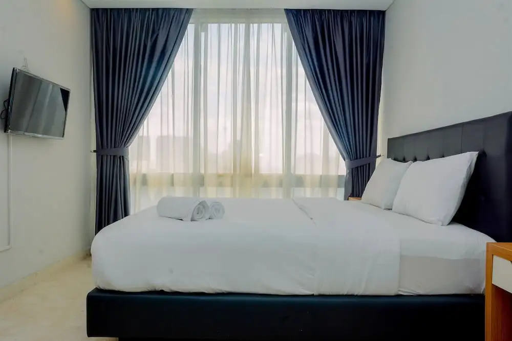 Comfy and Spacious 2BR The Masterpiece Epicentrum Apartment By Travelio