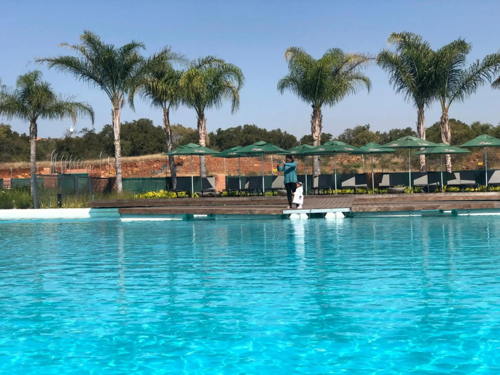 A Coastal/island experience at a Large 2 bed apartment at a Crystal Lagoon Estate