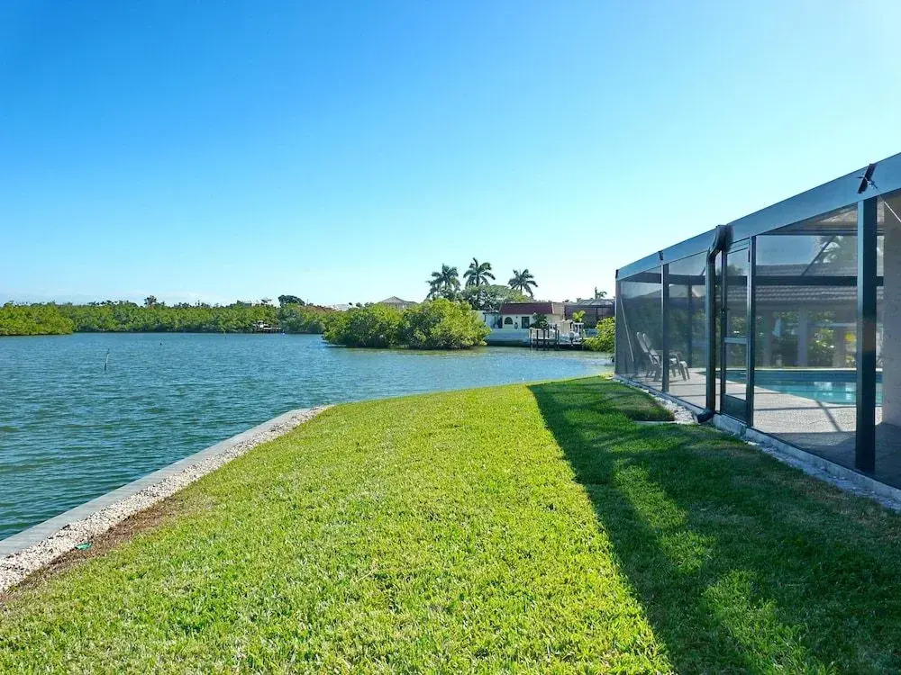 Waterfront home on key lot with pool/view of river