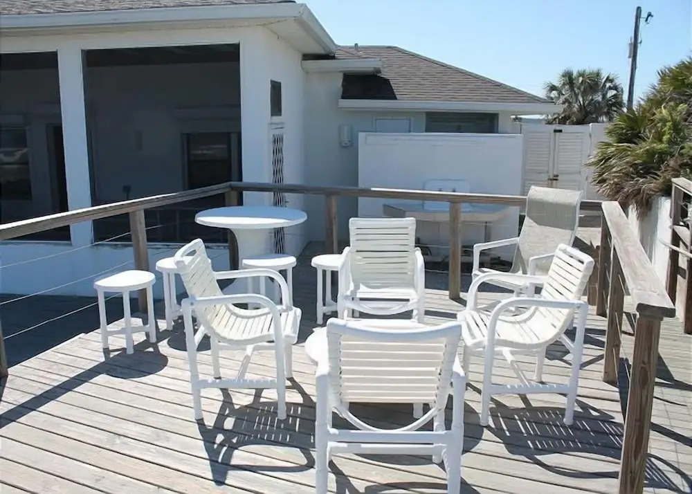 Ocean front Vacation Home with a large screened-in Patio by RedAwning