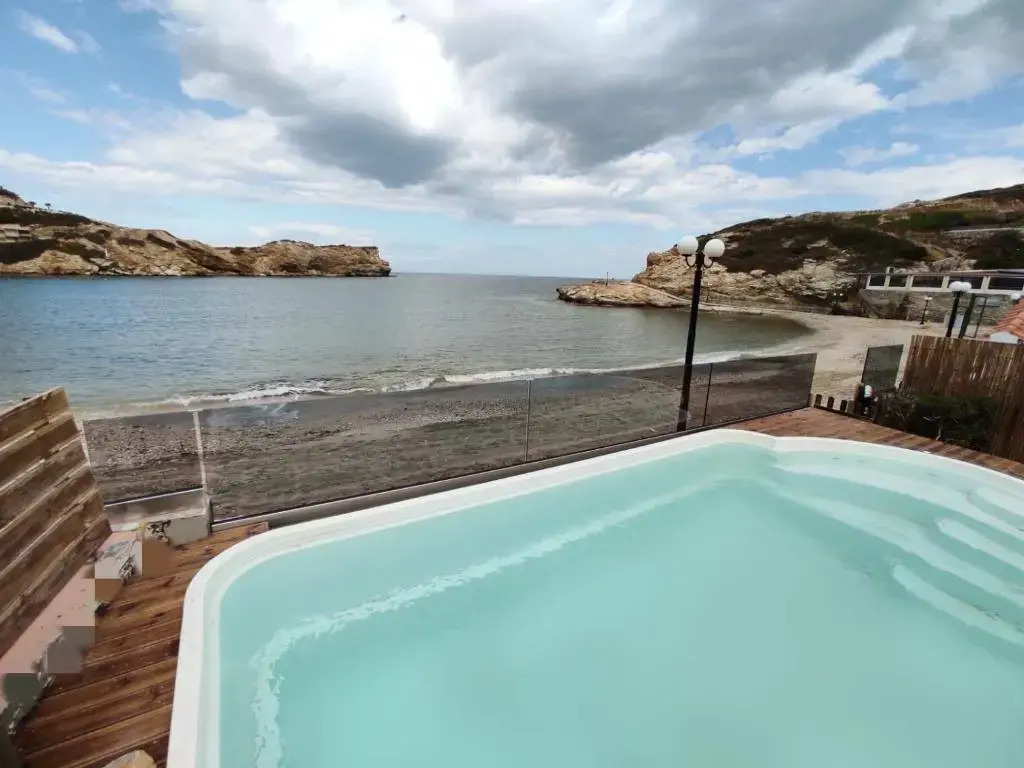 Beach front apartment with swimming pool