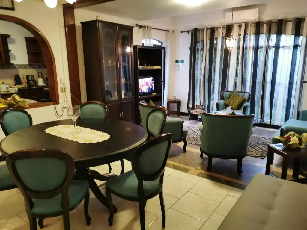 R&G Justlikehome Apartment 1 with blue sofa set and Apartment 2 with Garden View with brown sofa set