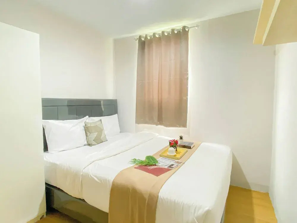 Simple 2Br At Azalea Suites Apartment