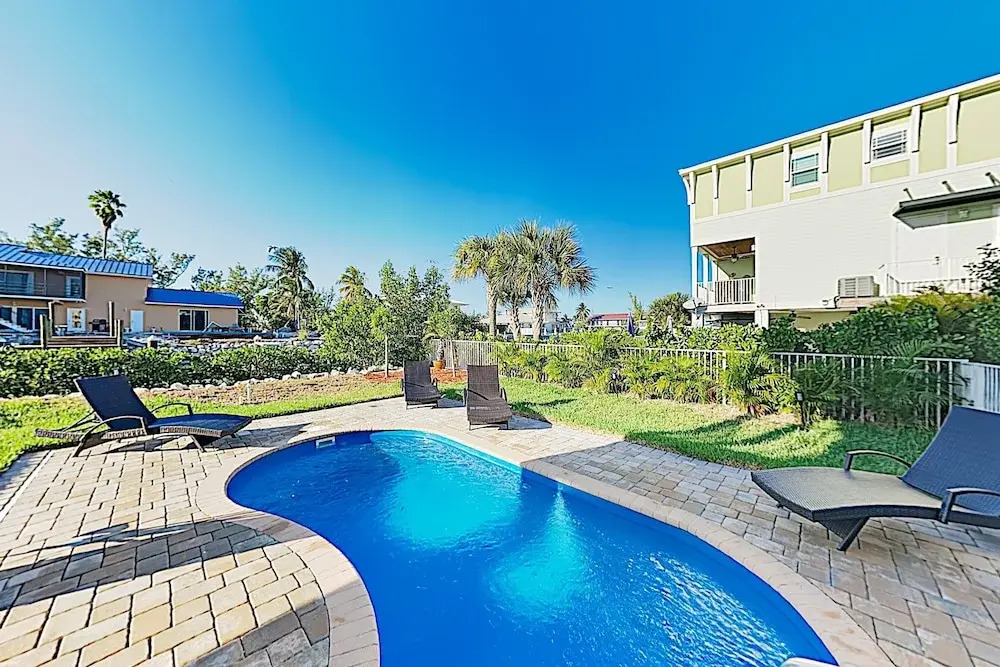 New Listing! New Canal W/ Pool & Dock 4 Bedroom Home